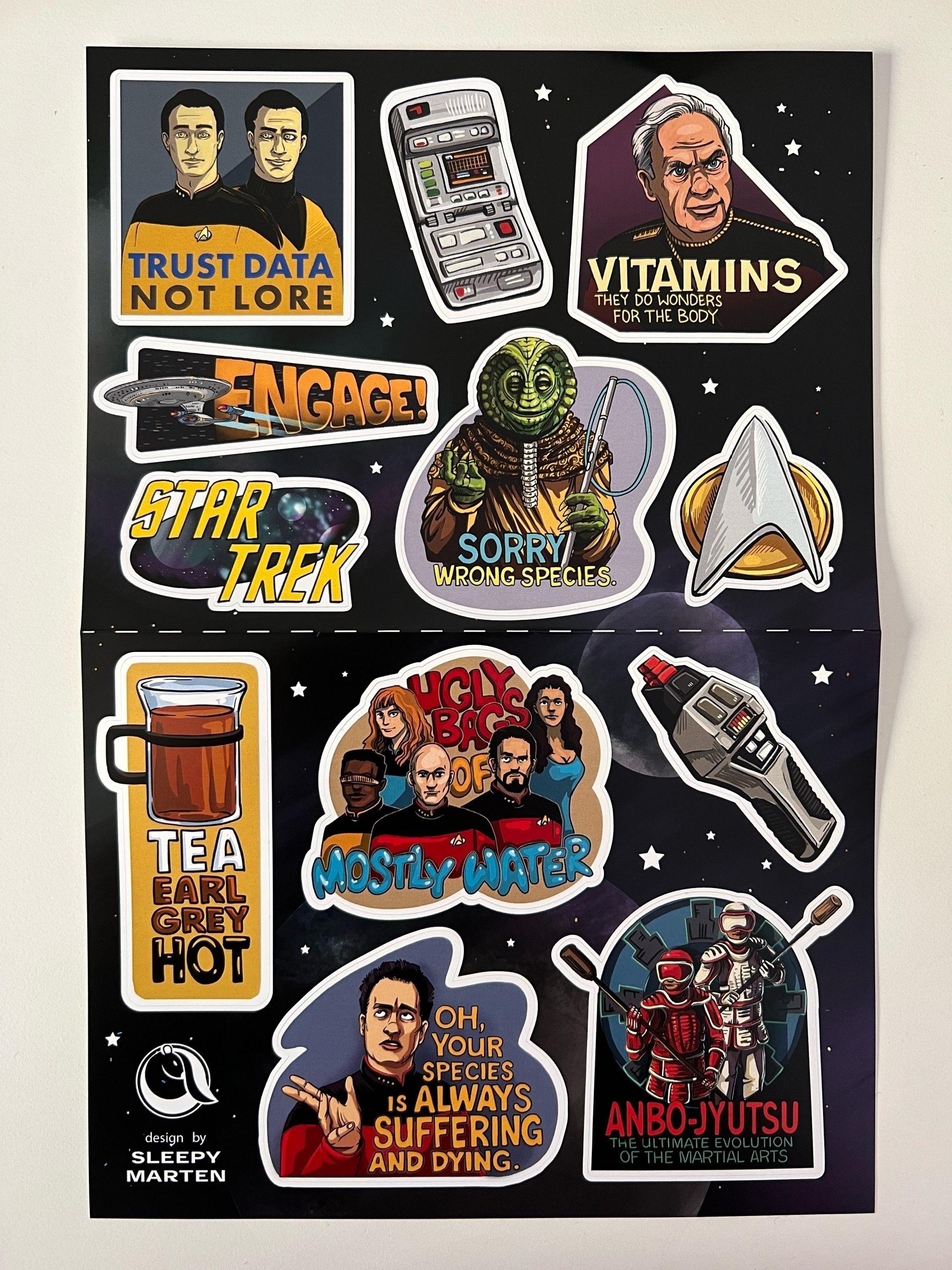 Sheet with a number of Star Trek-themed stickers based on fan art designs by the Etsy seller Sleepy Marten. 